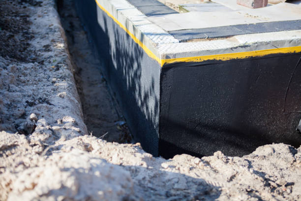 Professional Waterproofing technician working in Seaside Heights, NJ